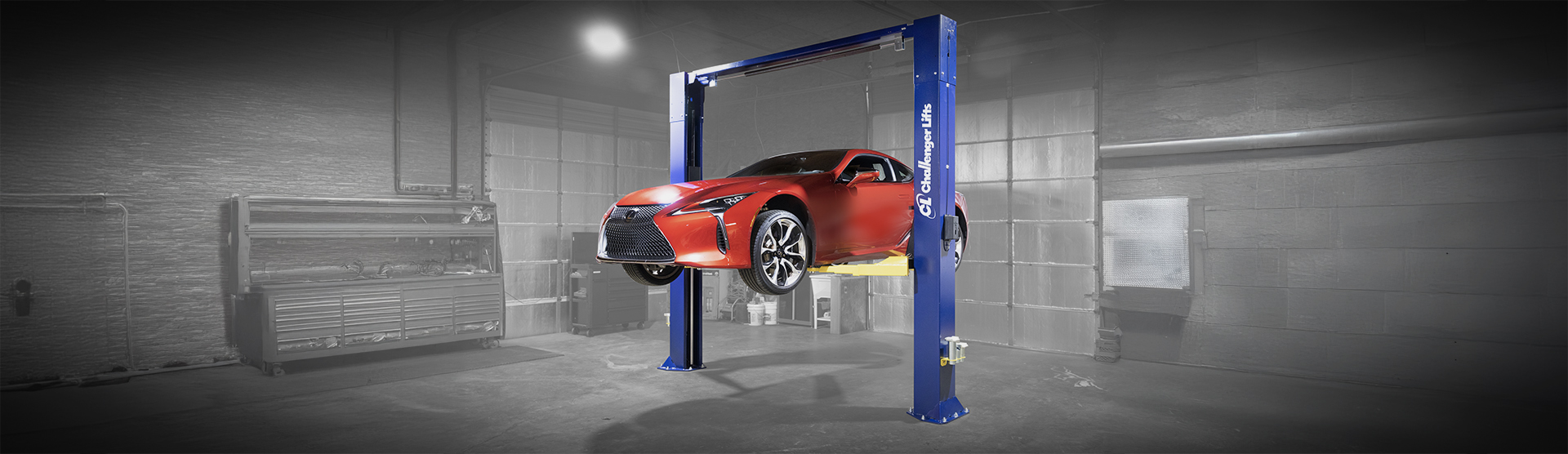 A car lifted off the ground by a Challenger Lifts CL10AV3