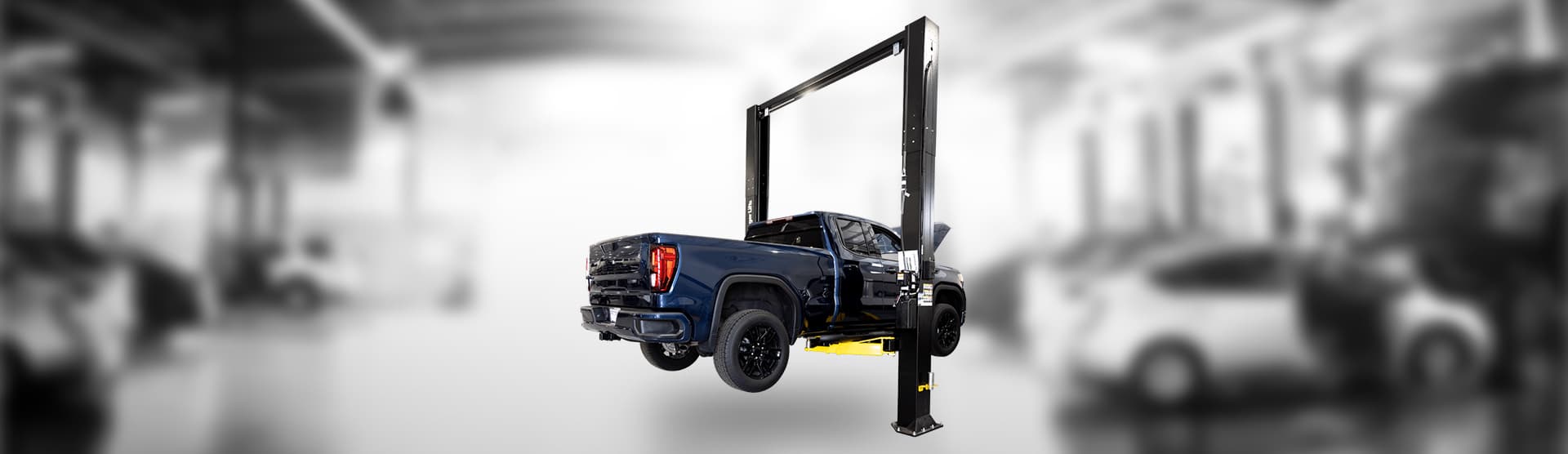 CL12A Heavy Duty 2 Post Lift with shop background