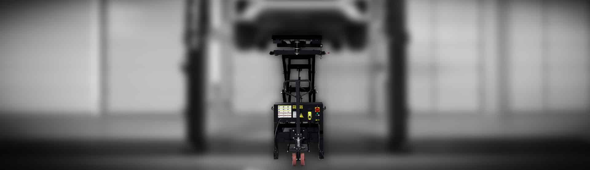 Challenger Lifts BT3300 being used to service an EV lifted on a two-post automotive lift